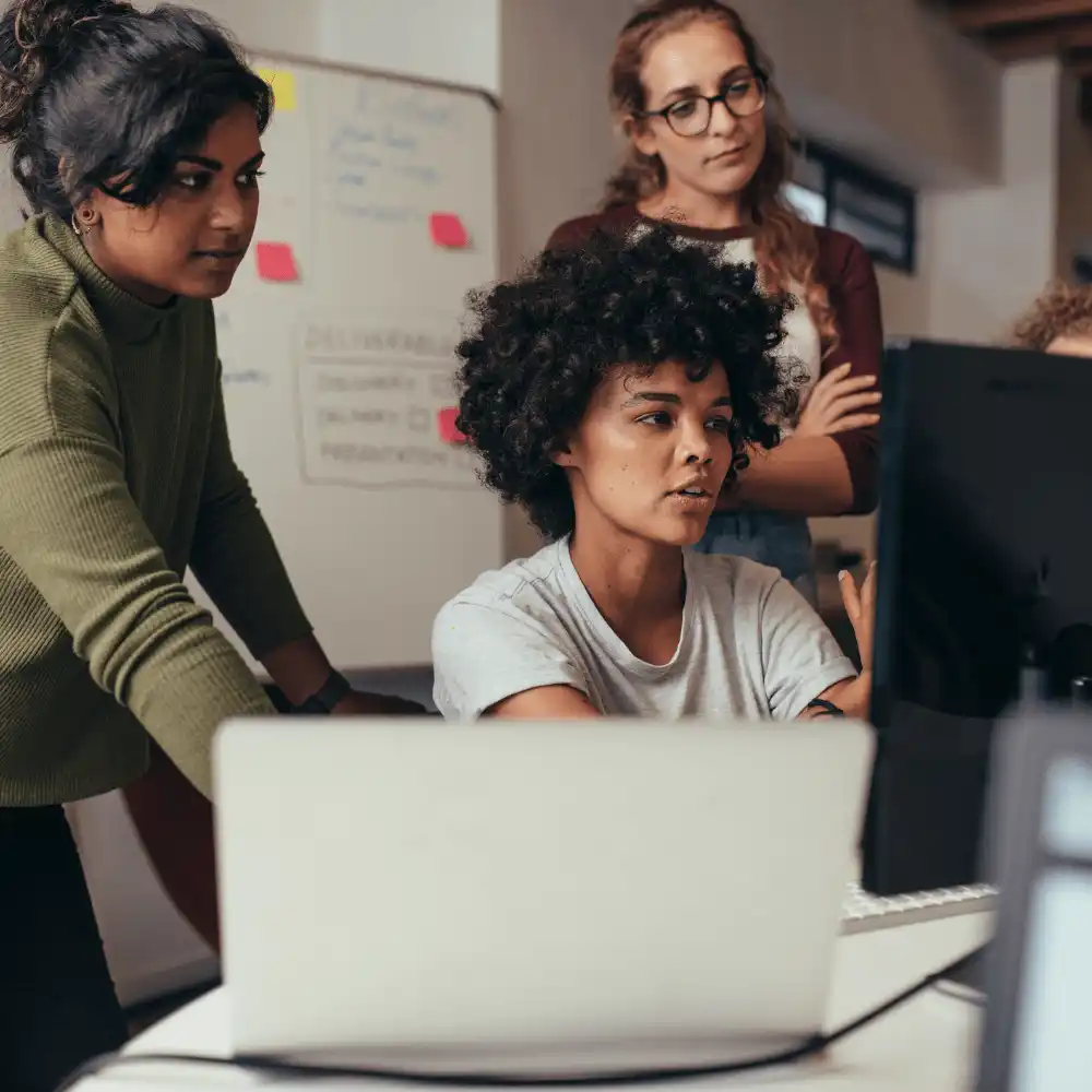 About eTender SA Three colleagues working together at a laptop